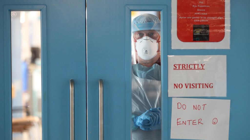 An infection control nurse looks out from a Covid-19 recovery ward at Craigavon Area Hospital in Co Armagh, Northern Ireland. File photograph: Niall Carson/PA Wire