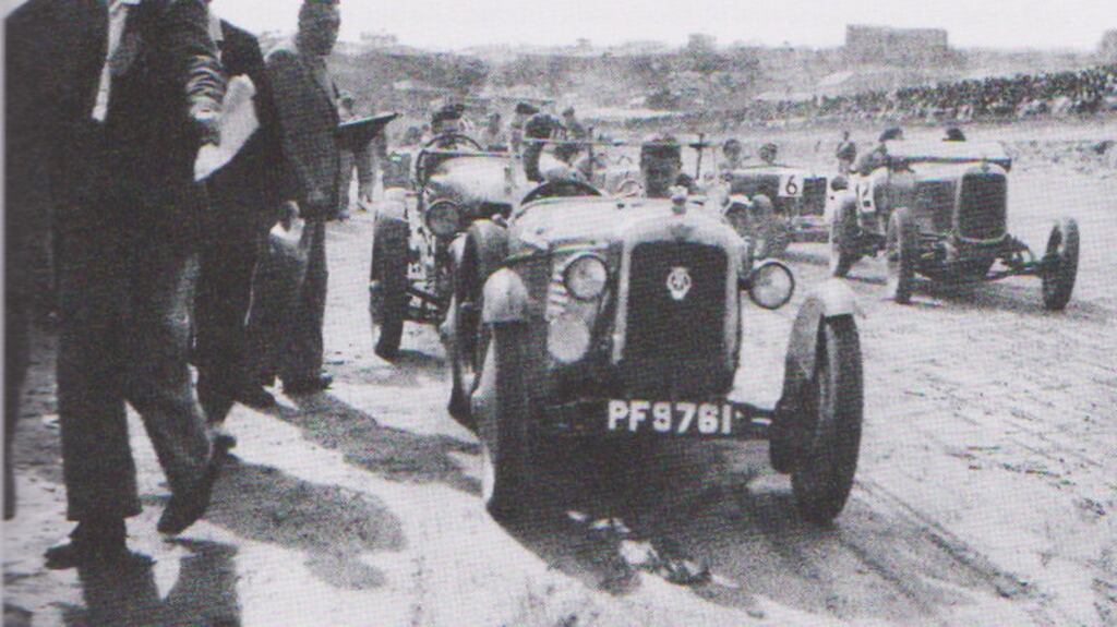 Cars racing on the strand at Tramore.