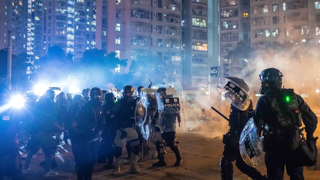 Riot police stand off against protestors at Wong Tai Sin district in Hong Kong, China on Monday. Photograph: Billy Kwok/Getty Images)