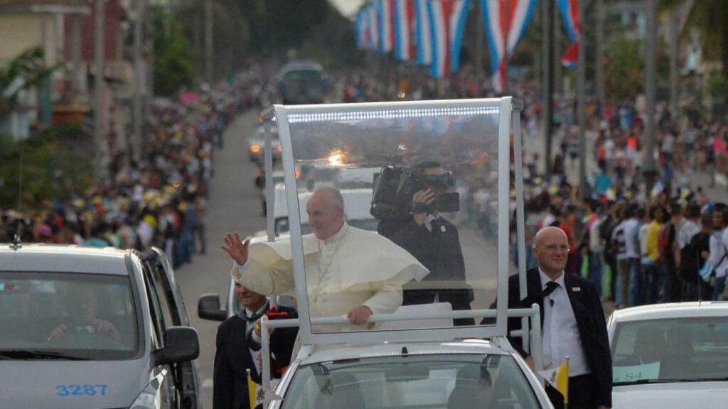 Pope Francis waves from the Popemobile after his arrival in Havana. Photograph: Adalberto Roque/EPA