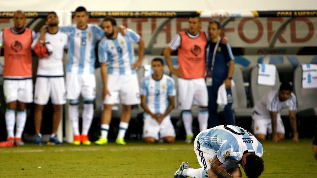 Lionel Messi reacts after missing his penalty during the Copa America final between Argentina and Chile. Photo: Jason Szenes/EPA