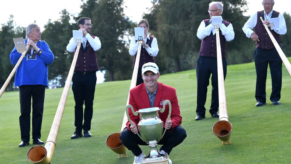 Denmark’s Rasmus Hojgaard  poses with the trophy after winning the Omega European Masters at Crans-sur-Sierre Golf Club in Crans-Montana, Switzerland. Photograph: Valerio Pennicino/Getty Images