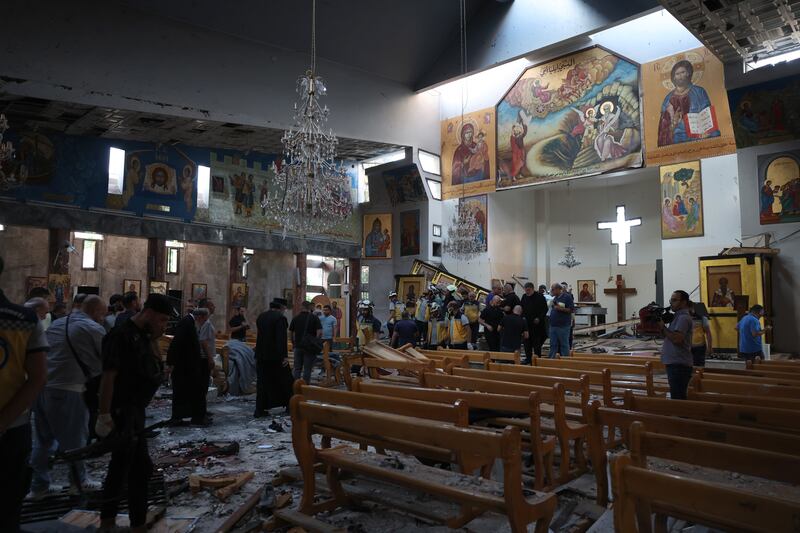 People survey the damage inside St Elias church following a suicide bombing on Sunday in Damascus, Syria. Photograph: Ali Haj Suleiman/Getty Images