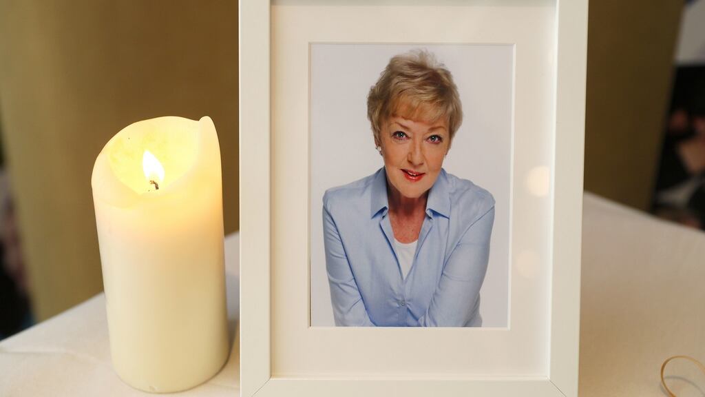 A photograph of the late broadcaster Marian Finucane sits beside a book of condolence at the RTÉ Radio Centre in Donnybrook, Dublin. Photograph: Brian Lawless/PA Wire