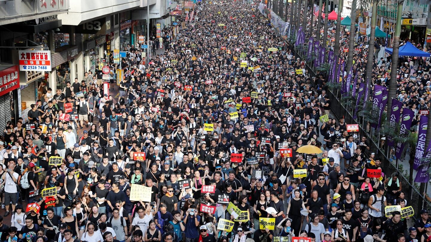 Anti-extradition Bill protesters march during the anniversary of Hong Kong’s handover to China in Hong Kong on Monday. Photograph: Tyrone Siu/Reuters