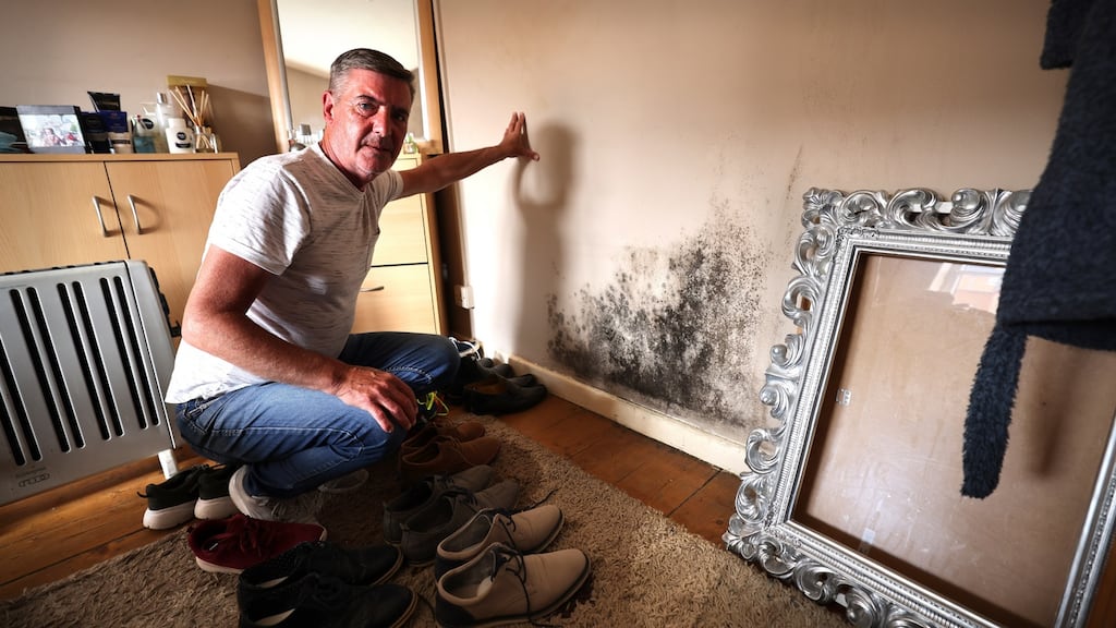 Michael Conway a resident of Oliver Bond House, showing some mould on wall of his bedroom. Photograph: Dara Mac Dónaill
