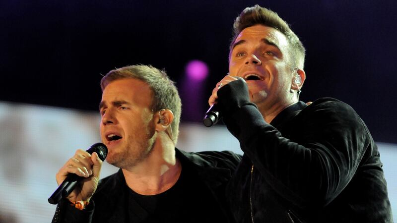 Robbie Williams and Gary Barlow of Take That performing at the Heroes Concert at Twickenham Stadium on September 12th, 2010. Photograph: Jim Dyson/Getty Images