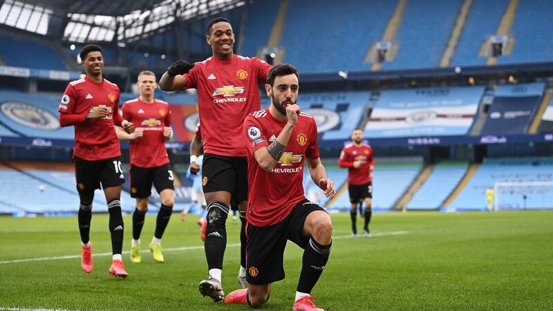 Manchester United celebrate Bruno Fernandes’s opener against City. Photograph: Laurence Griffiths/Getty