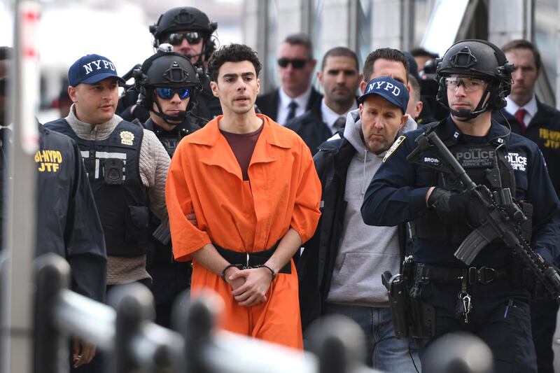 Luigi Mangione being escorted by police in New York on December 19th following his extradition from Pennsylvania. Photograph: Pamela Smith/AP