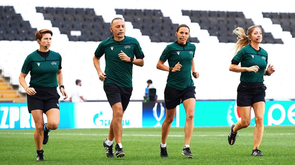 Assistant referee Michelle O’Neill of Ireland, fourth official Cuneyt Cakir of Turkey, main referee Stephanie Frappart of France and assistant referee Manuela Nicolosi of France, run during a training session ahead of Uefa Super Cup at the Besiktas Park in Istanbul. Phopto: Uefa