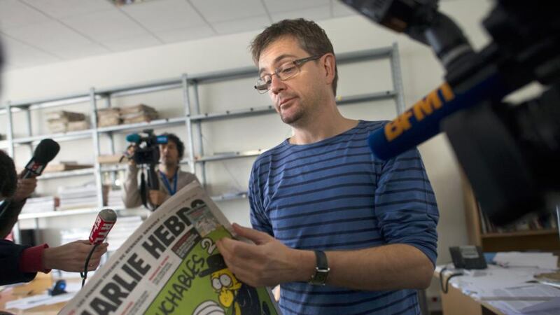 First victim: Stéphane Charbonnier, director of Charlie Hebdo, talks to journalists about one of the satirical magazine’s controversial issues, in 2012. Photograph: Fred Dufour/AFP/Getty