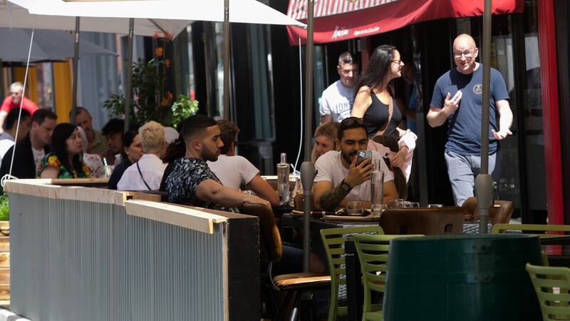 People enjoying the good weather outside restaurants on  Capel Street in Dublin on Friday. Photograph: Gareth Chaney/Collins