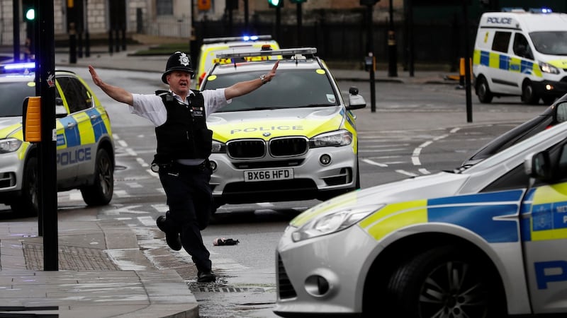 A police officer outside parliament during an incident on Westminster Bridge in which more than 40 people were injured. Photograph: Stefan Wermuth/Reuters