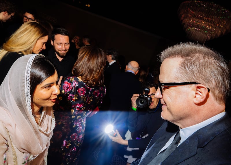 Malala Yousafzai, there on behalf of the documentary short Stranger at the Gate, speaking with The Whale star Brendan Fraser. Photograph: Sinna Nasseri/The New York Times