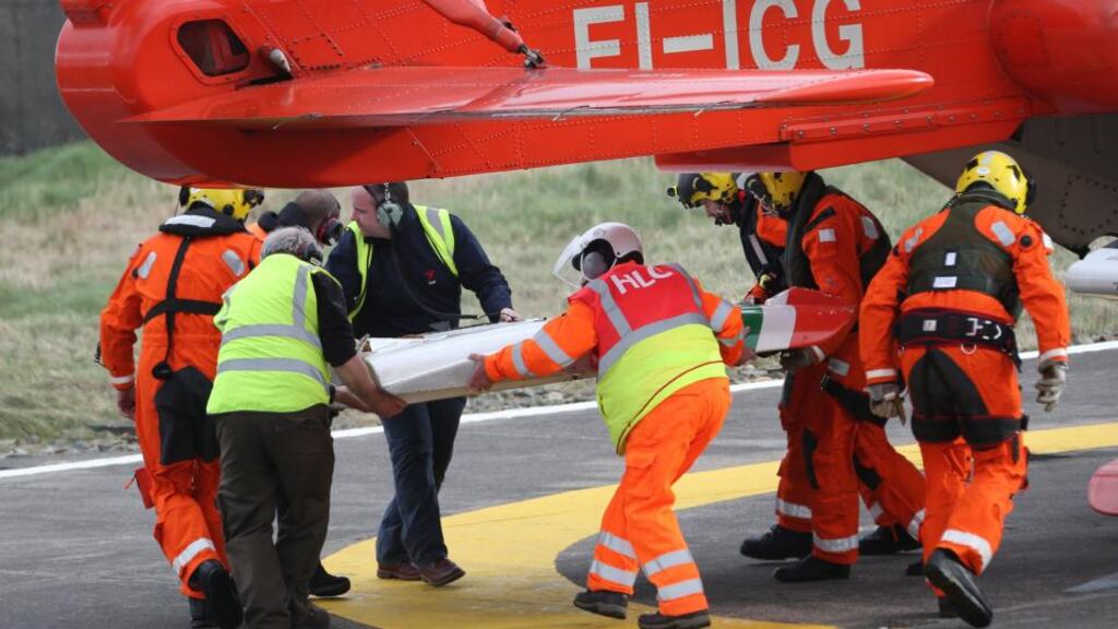 Members of the Irish Coast Guard return to base after recovering parts of the crashed helicopter off the Co Mayo coast. Photograph:  Colin Keegan, Collins Dublin