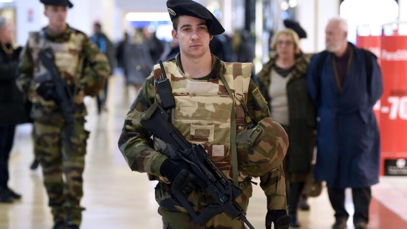 French soldiers patrol in a shopping center in Lyon on January 16th, 2015, after France announced an unprecedented deployment of thousands of troops and police to bolster security at “sensitive” sites following last week’s jihadist attacks in Paris. Photograph: Philippe Desmazes/AFP/Getty Images