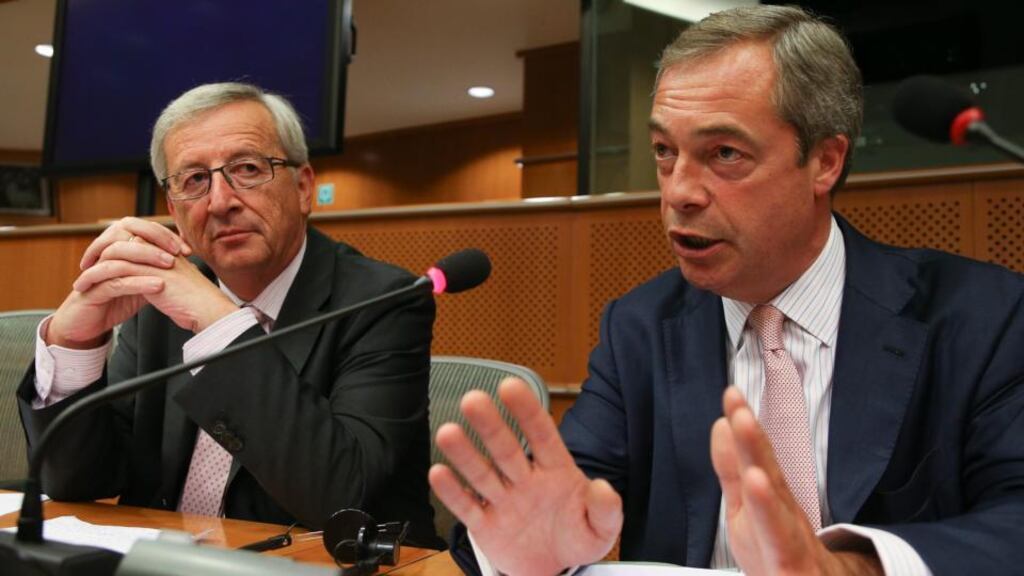 Jean-Claude Juncker, European Peoples’ Party group candidate designate for the presidency of the European Commission (left) and Nigel Farage, chairman of the Europe of Freedom and Democracy group of the European Parliament, in Brussels yesterday. Photograph: EPA/Julien Warnand