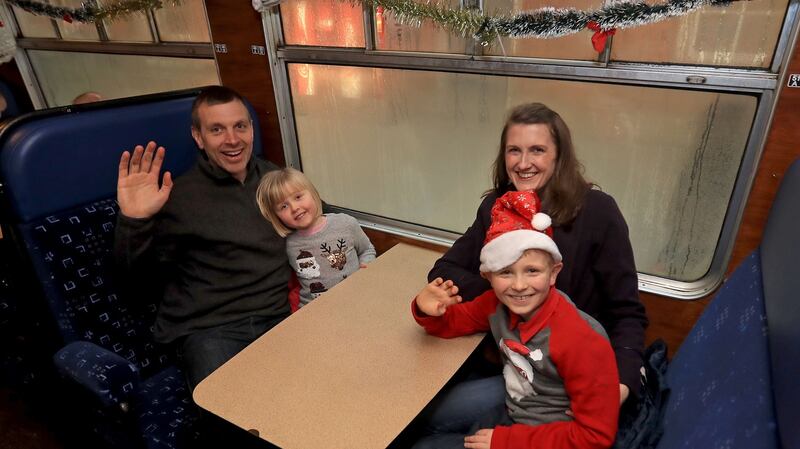 Joe and Mary Harpur with their children Sarah (4) and Thomas (8) onboard the Santa Express. Photograph: Donall Farmer