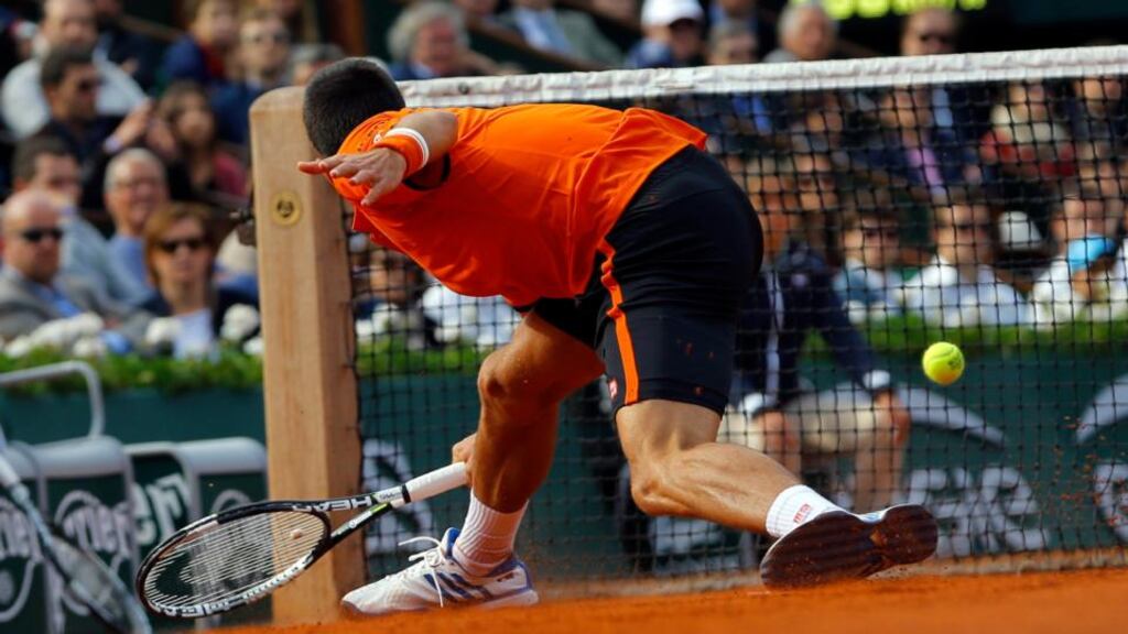 Novak Djokovic of Serbia in action against Richard Gasquet of France during their fourth round match for the French Open tennis tournament at Roland Garros in Paris. Photo: EPA