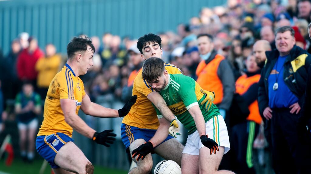 Tourlestrane’s Cian Surlis comes under pressure from with Pearse Ruttledge and Adam Naughton of Knockmore during the Connacht club semi-final in Ballina. Photograph: Evan Logan/Inpho