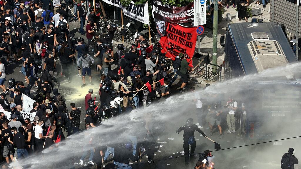 Clashes between riot police and protesters after the Golden Dawn trial verdict was announced in Athens. Photograph: Orestis Panagiotou/EPA