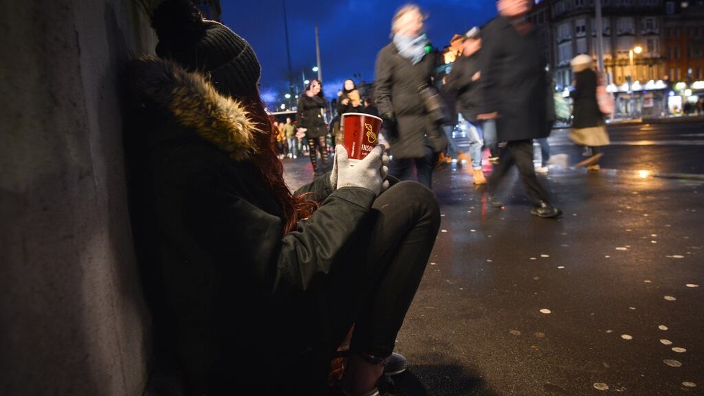 A woman begging on  O’Connell Bridge,  Dublin this year. Photograph: Artur Widak/NurPhoto via Getty Images