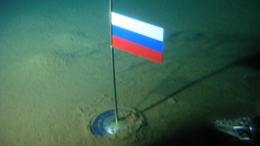 A titanium capsule with the Russian flag is seen seconds after it was planted by the Mir-1 mini submarine on the Arctic Ocean seabed under the North Pole during a record dive om 2007. Photograph: Association of Russian Polar Explorers/AP