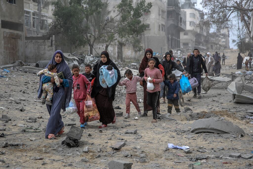 Palestinians flee on Monday after another Israeli bombardment of Gaza City. Photograph: AFP via Getty Images