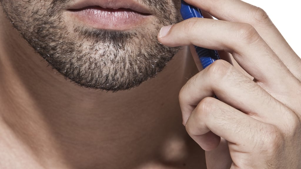 young man shaving for pricewatch