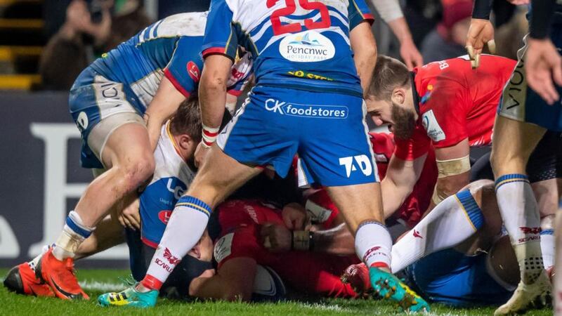 Iain Henderson burrows over for one of his brace of tries against the Scarlets. Photograph: Morgan Treacy/Inpho