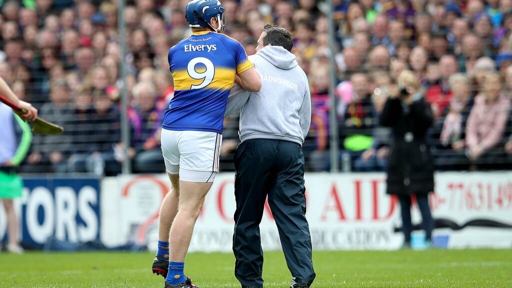 Wexford Manager Davy Fitzgerald clashes with Jason Forde of Tipperary during the league semi-final. Photograph: Ryan Byrne/Inpho