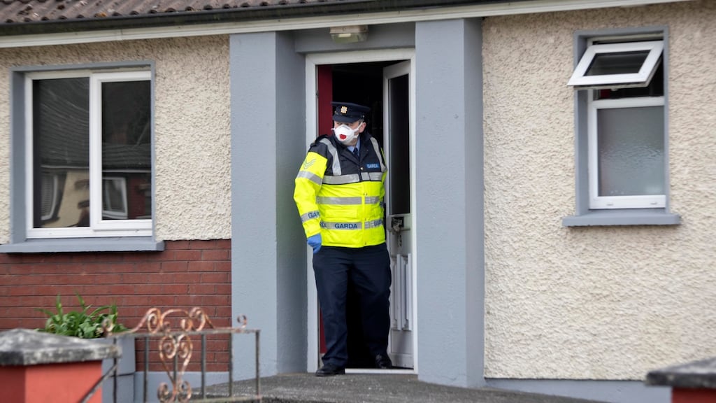 A Garda at the house on Blackthorn Close, Kells, Co Meath, where two men, one from Navan, and one from Kells died in a house fire this morning. Photograph: Colin Keegan/Collins