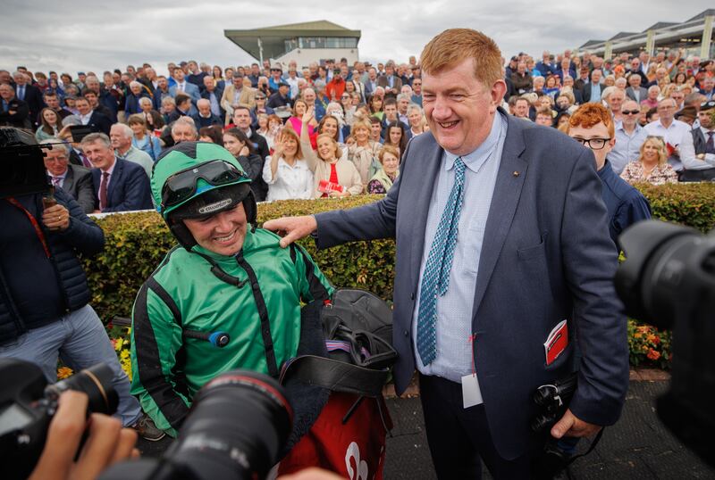 Jordan Gainford celebrates with trainer John ‘Shark’ Hanlon after Hewick's victory in The Tote Galway Plate with Hewick. Photograph: James Crombie/Inpho