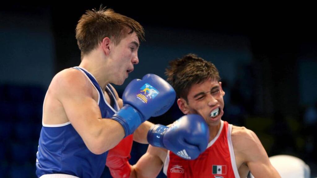 Michael Conlan (blue) lands a left to the jaw of Mexican Brian Gonzalez on his way to victory at the Wortld Boxing Champoionships in Almaty, Kazakhstan. Photograph: Cathal Noonan/Inpho