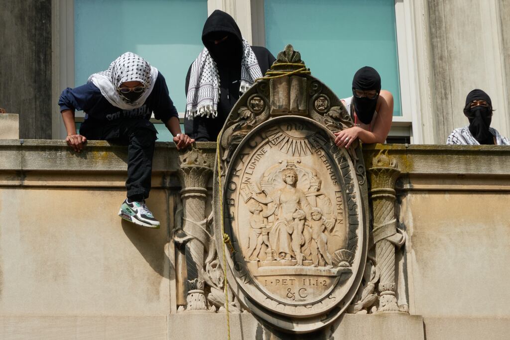 Pro-Palestinian protesters occupy Hamilton Hall on the campus of Columbia University in New York this week. Today’s young activists, facing a different set of risks than their predecessors did, often choose to obscure their identities. Photograph: Bing Guan/The New York Times