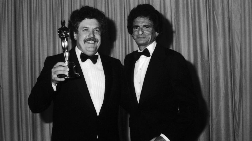 British actor and screen writer Colin Welland holding his Best Original Screenplay Academy Award for ‘Chariots of Fire’ after the ceremony, 29th March 1982. He is with Polish author Jerzy Kosinski who presented the award. Photograph: Hulton Archive/Getty Images
