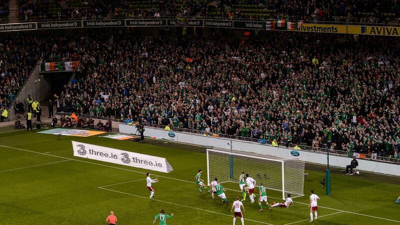 Coleman scores for Ireland as Lansdowne Road celebrates. Photo: Stephen McCarthy/Sportsfile via Getty Images