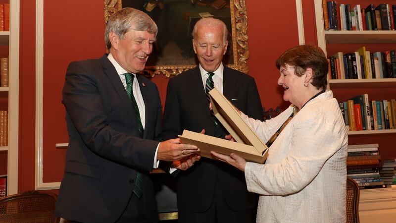 Former US vice-president Joe Biden at a reception for the launch of the Cambridge History of Ireland at the Irish ambassador’s residence in Washington on Monday, with Ambassador Dan Mulhall and Prof Bríona Nic Dhiarmada from the University of Notre Dame, presenting Mr Biden with a special edition of a book on the Easter Rising. Photograph: Marty Katz