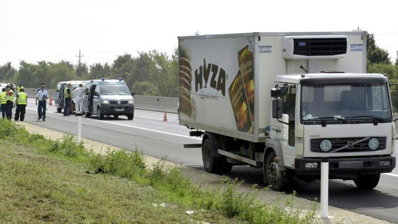The lorry in which refugees were found dead stands on autobahn A4 between Parndorf and Neusiedl in Austria on Thursday. Photograph: EPA