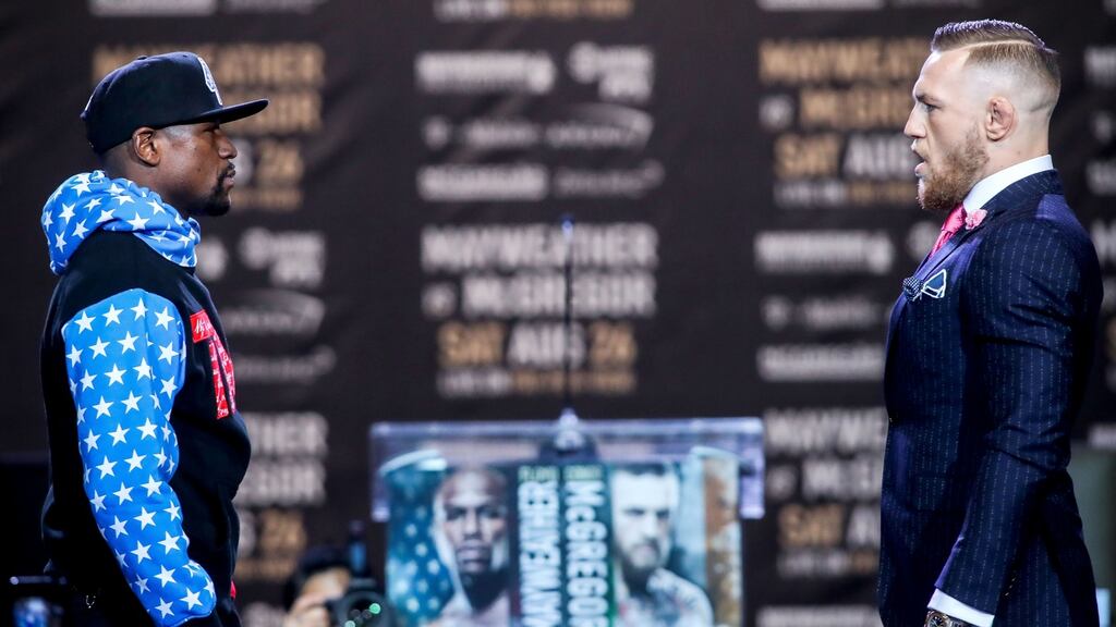 Floyd Mayweather and Conor McGregor face off. Photograph: Inpho