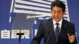 Japan shares at two-decade top as Abe wins