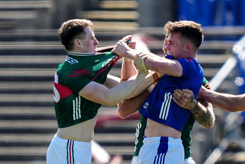 Paddy Durcan of Mayo and Cavan's Dara McVeety get to grips with each other during Sunday's match at MacHale Park. Photograph: James Lawlor/Inpho