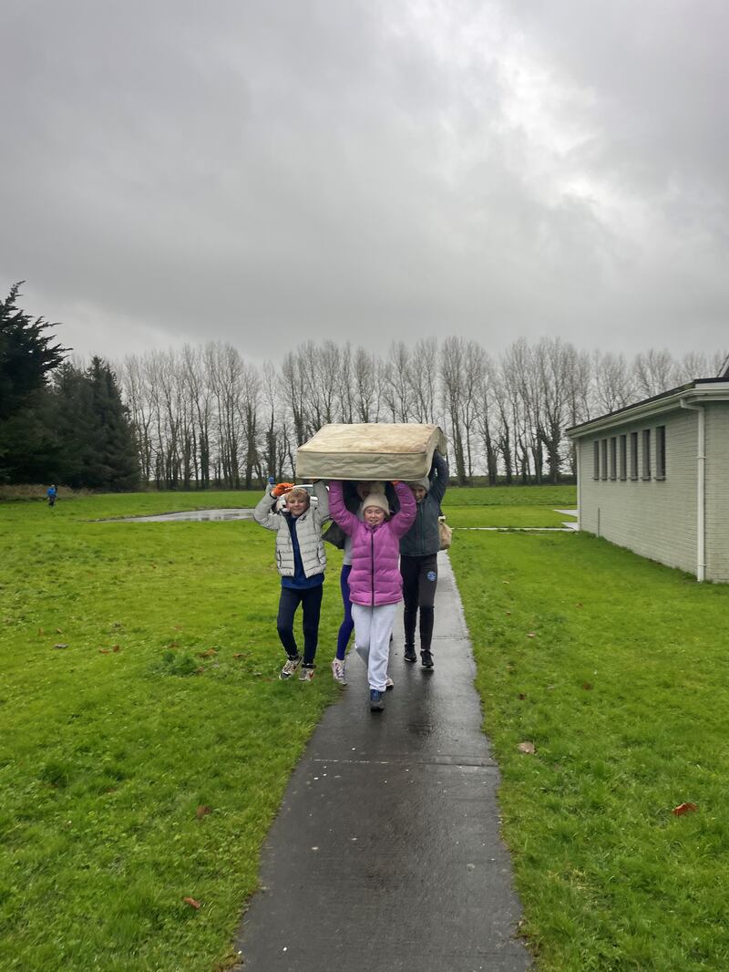 Volunteers from Flossie and the Beach Cleaners recover an abandoned mattress from a beach around Ireland.