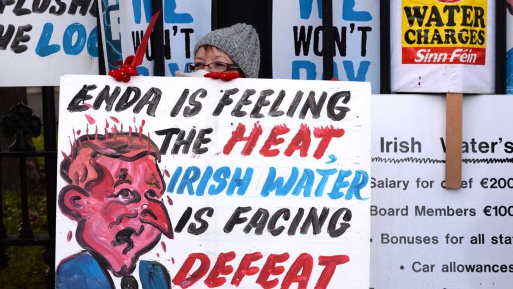 A protestor takes part in a demonstration against Irish Water in Dublin. Payment compliance will be key for Irish Water’s ability to raise revenue and deliver on its investment programme, the troika said in its report. Photograph: Brenda Fitzsimons/The Irish Times