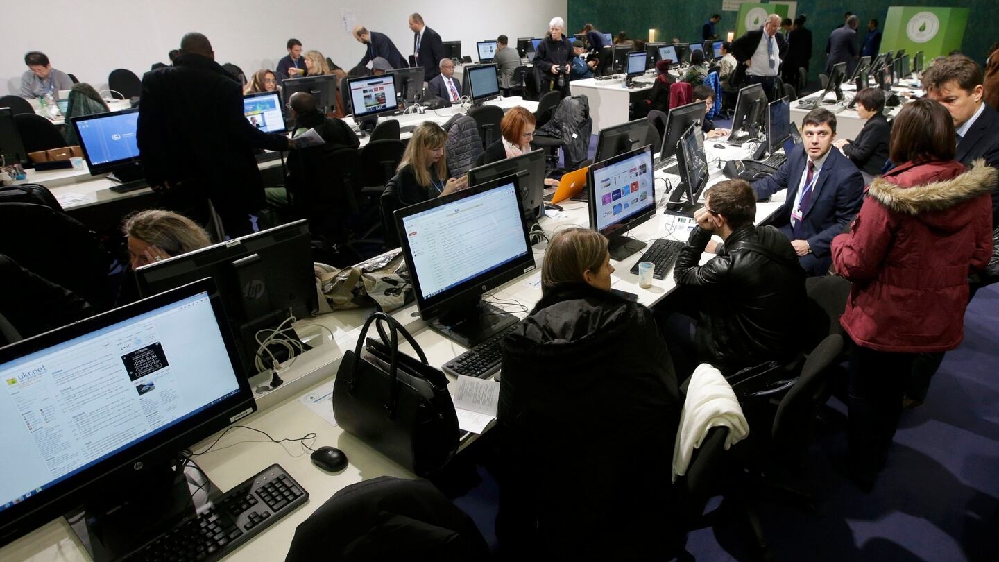 Journalists work in the press room during the opening day of the World Climate Change Conference 2015 (COP21) at Le Bourget. Photograph: Reuters/Jacky Naegelen