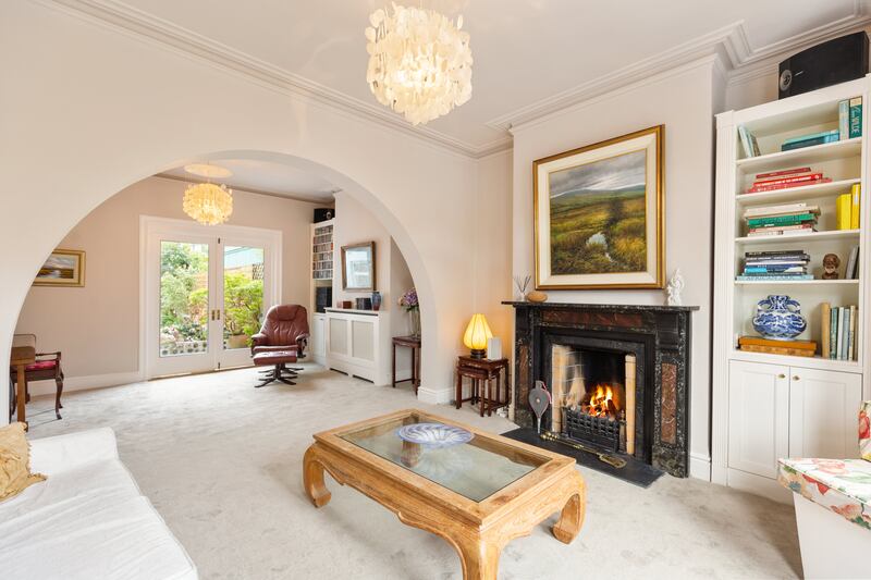 An archway divides the two reception rooms at hall level