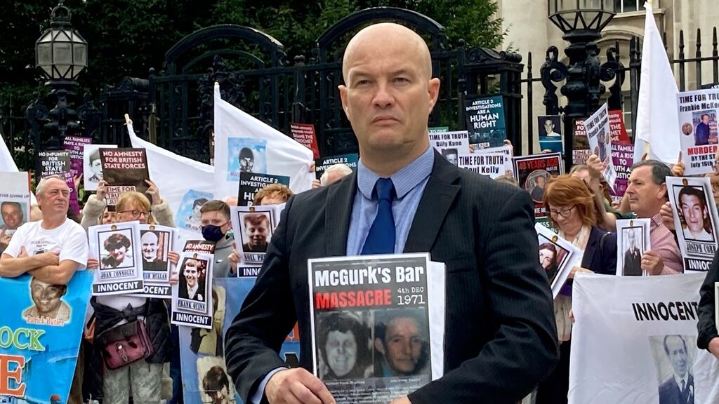 Time for Truth campaign spokesperson Ciaran MacAirt at a demonstration outside the courts in Belfast . Photograph: Rebecca Black/PA Wire