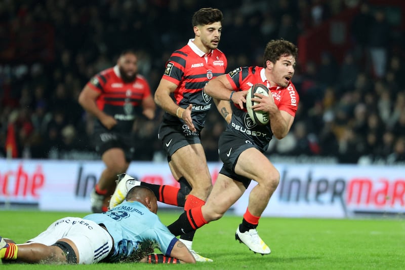 Toulouse's French scrum-half Antoine Dupont runs with the ball. Photograph: Charly Triballeau/AFP via Getty