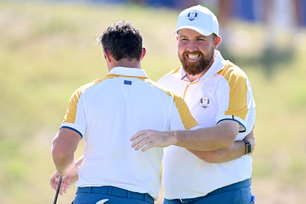 Shane Lowry and Rory McIlroy interact on the 18th green after finishing their practice round in Rome ahead of the Ryder Cup. Photograph: Ross Kinnaird/Getty