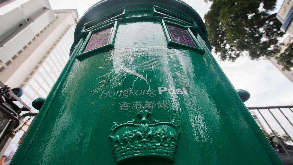 A cast iron Hong Kong post box is seen with British royal cipher in Central District, Hong Kong, China, October 2015. Photograph: Alex Hofford